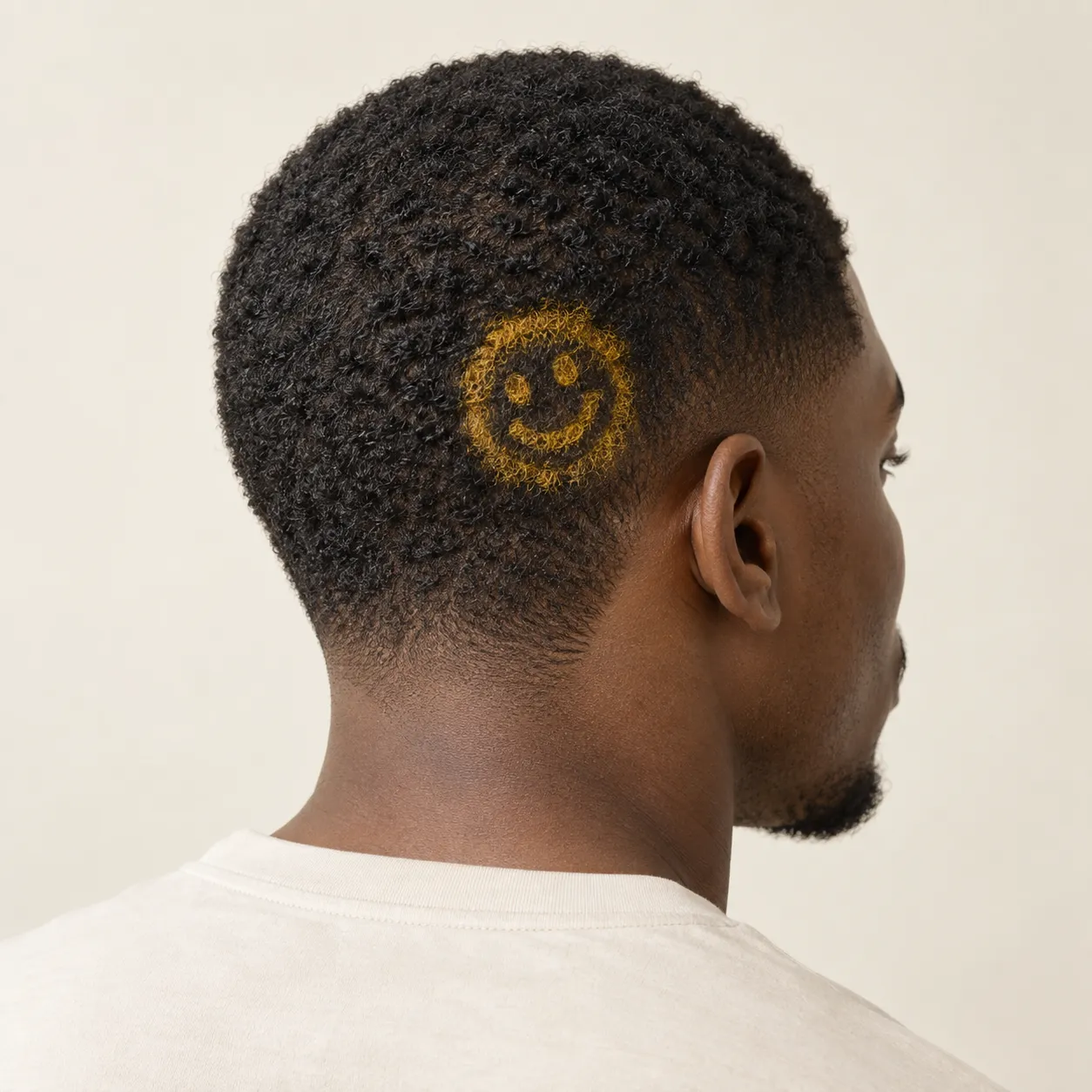Generated fictional man, viewed from behind, with a yellow smiley emblem colored into very short dark hair.