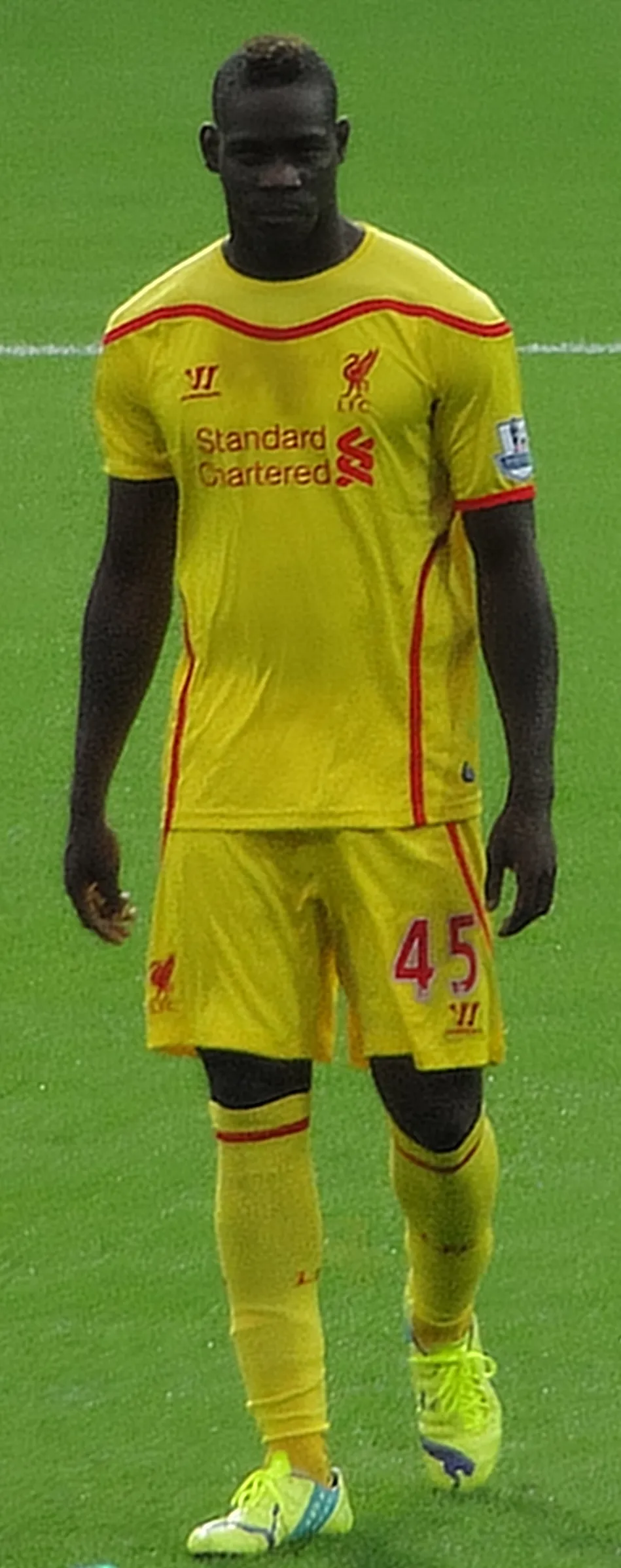 Mario Balotelli with Liverpool in September 2014 wearing a short tapered haircut.