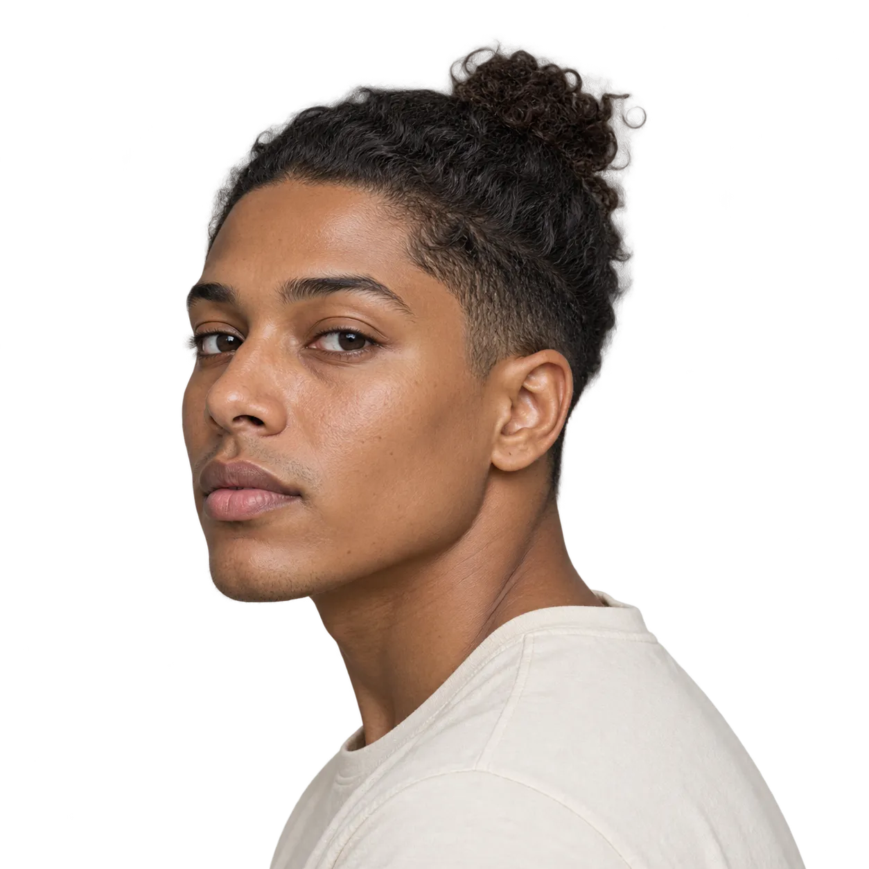 Transparent editorial reference showing a compact curly top knot.